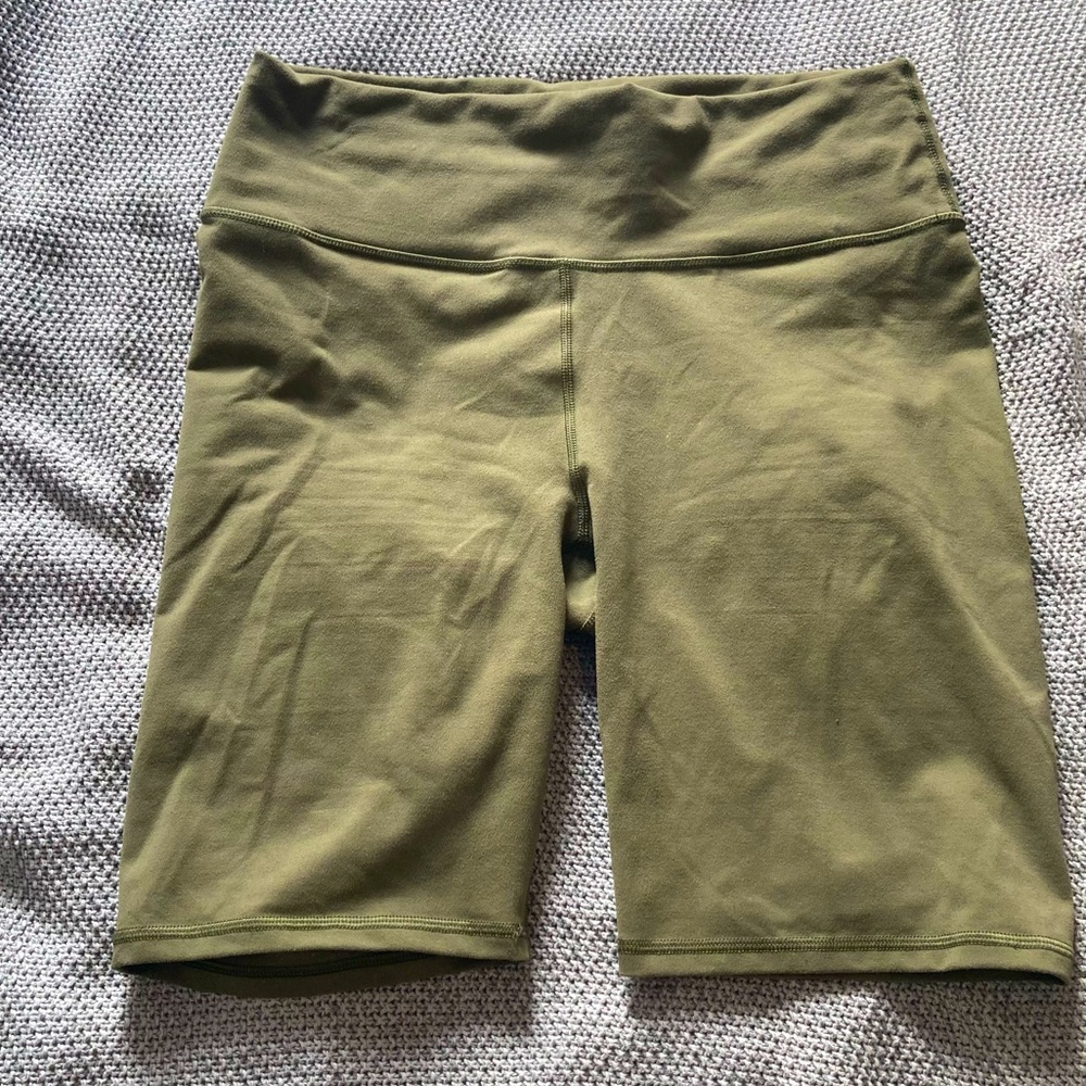 Fabletics Powerhold High-Waist Define 9” Bike Short in Olive Green size L